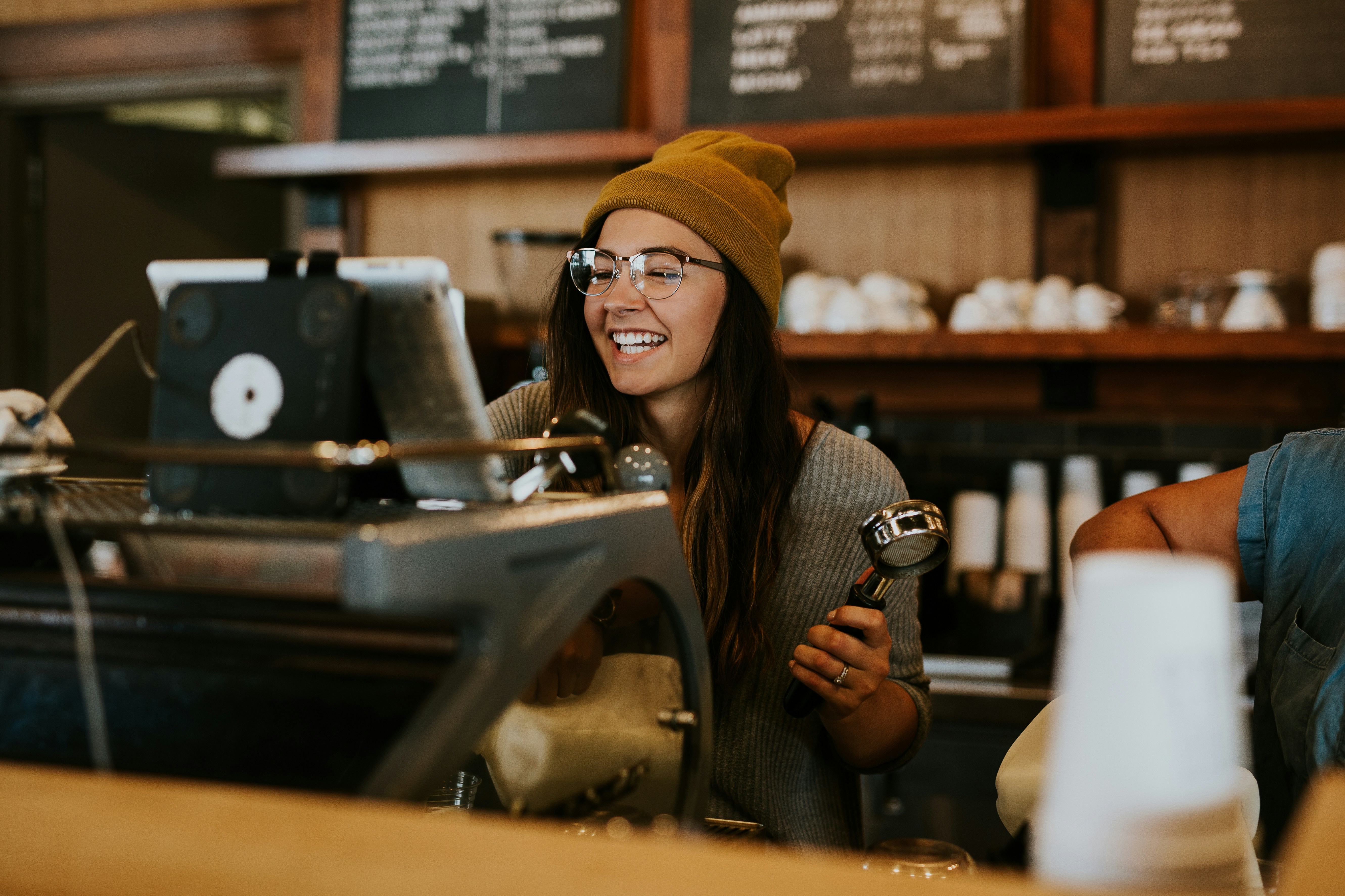 Smiling barista in a local café